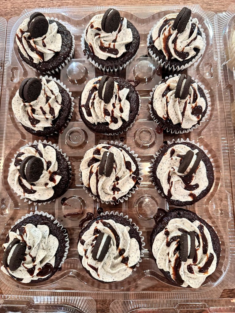 Chocolate cupcakes with cookies and cream frosting and Oreo cookies